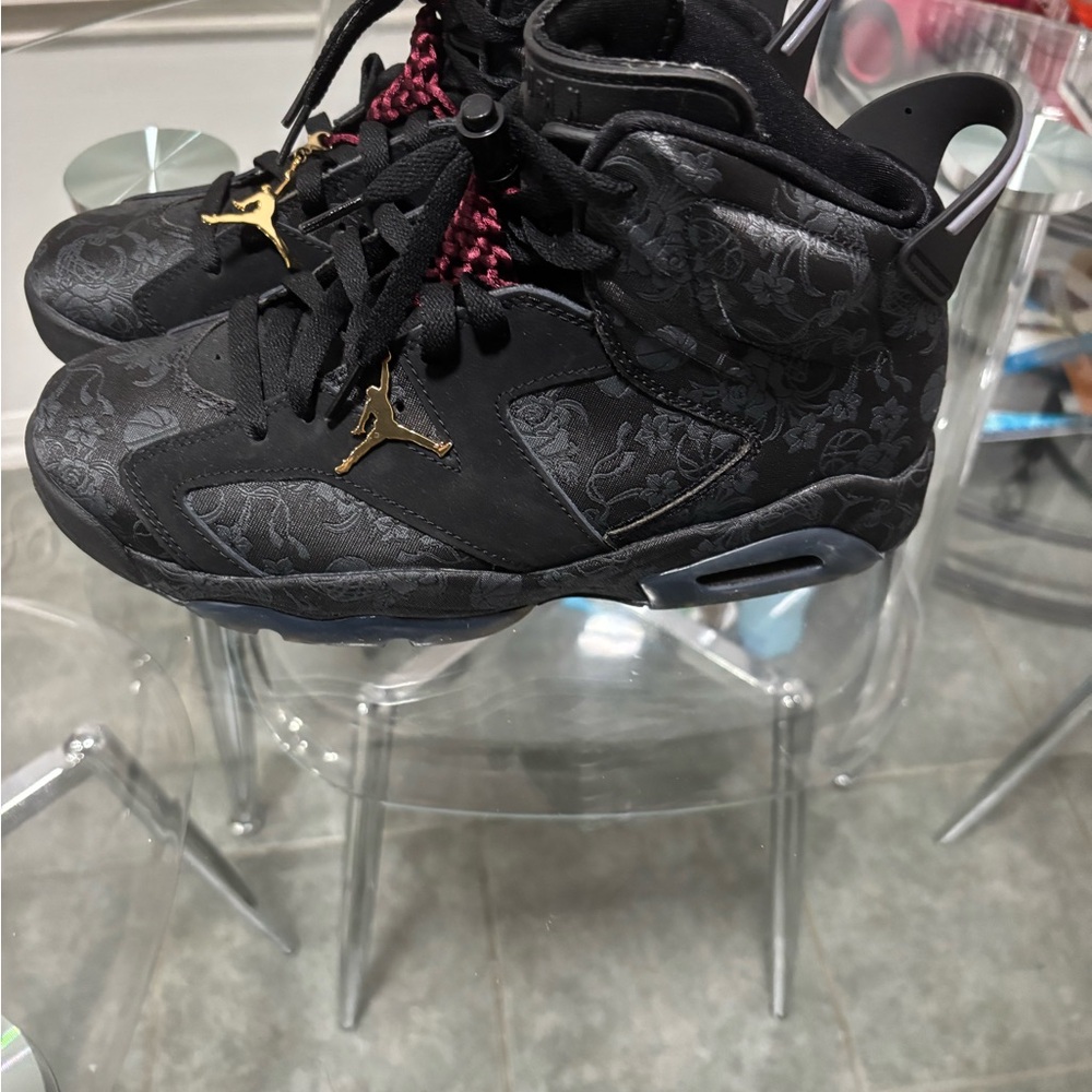 Jordan women’s casually worn Black and Gold Sneakers